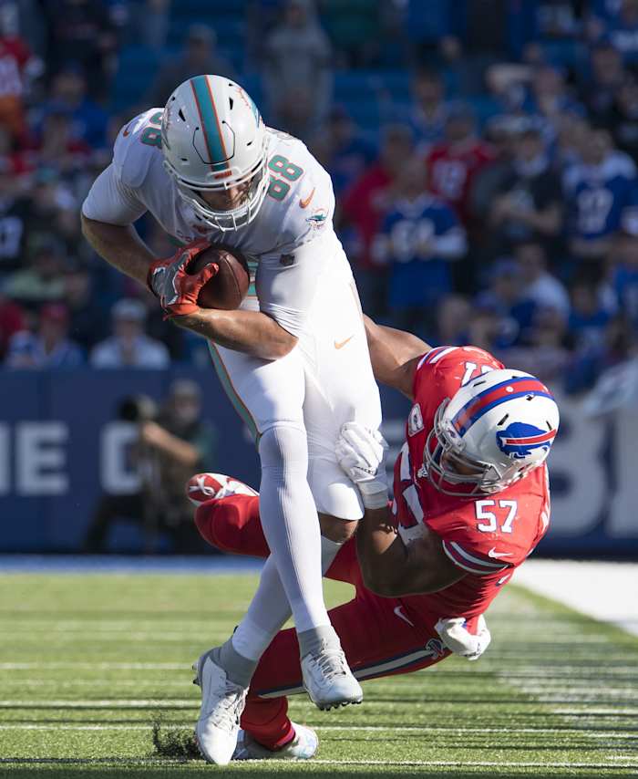 Mike Gesicki makes one of four catches against the Bills.